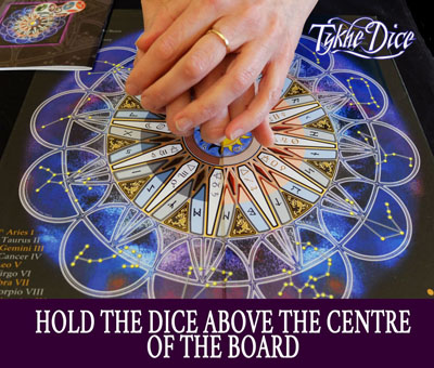 Hold the dice above the centre of the board